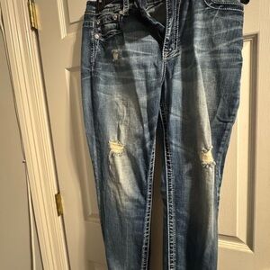 Women's Distressed Blue Jeans